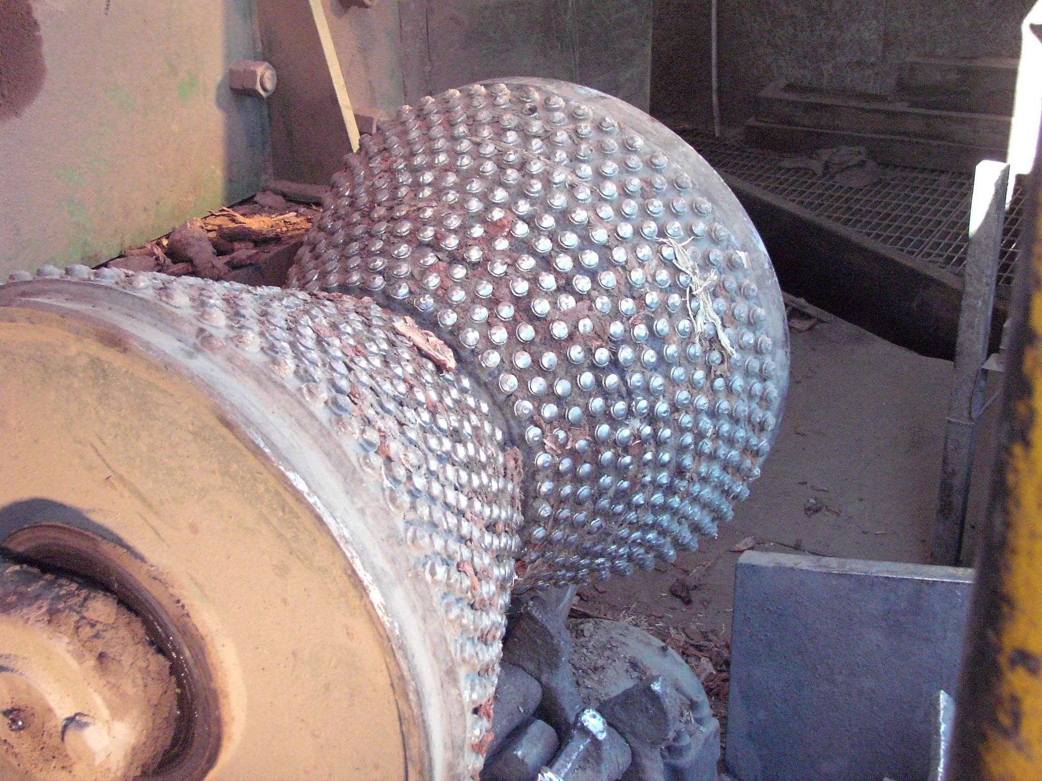 Feed rollers fitted with Spike Series TuffStudds after heavy use